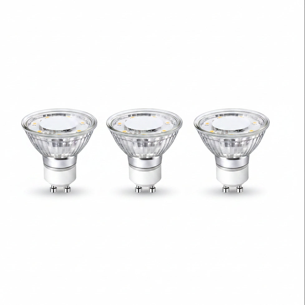 Three LED light bulbs with GU10 base on a white background