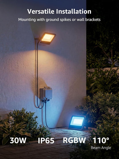 Lepro 30W IP65 waterproof outdoor flood lights installed on a wall and ground near garden bushes